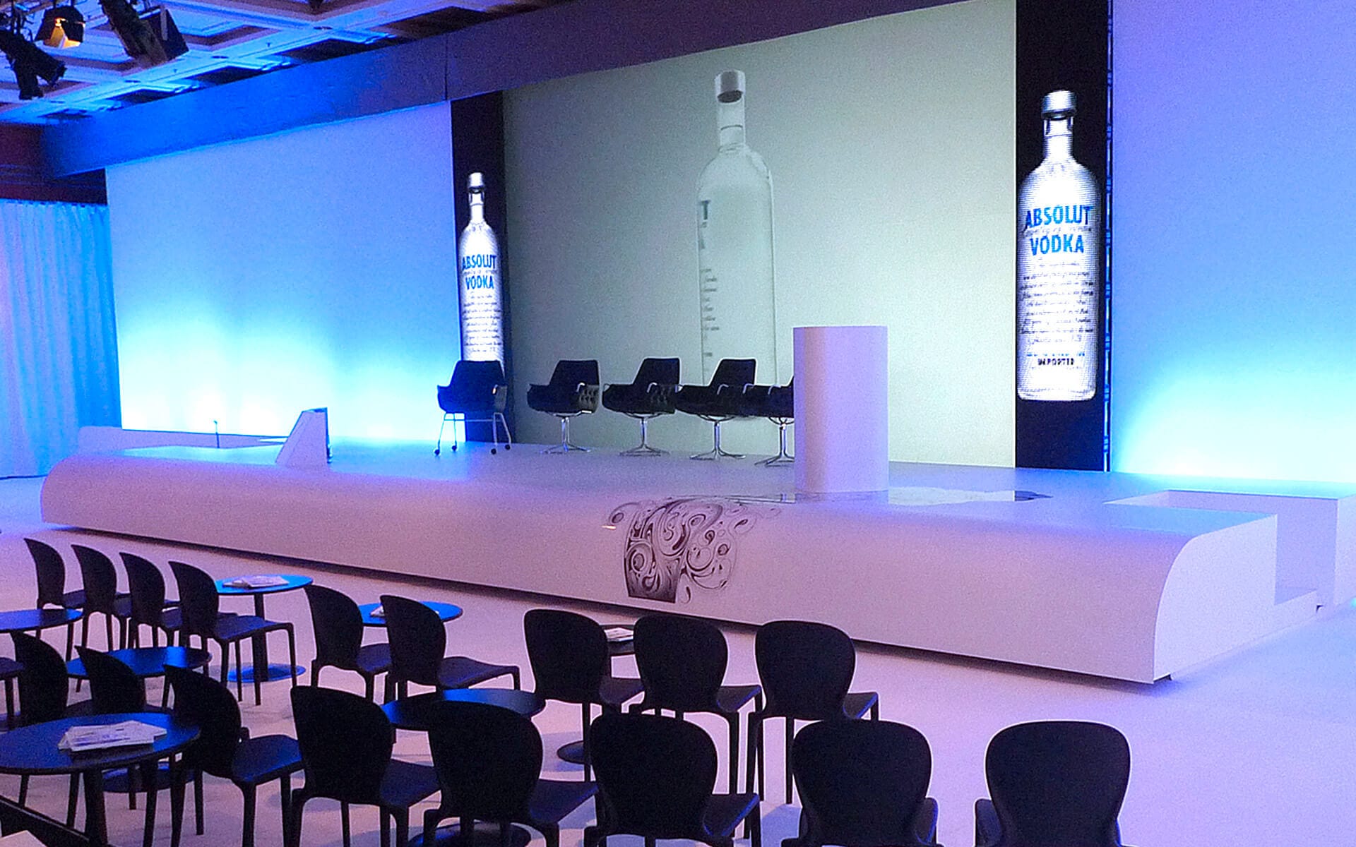Event stage with LED-illuminated stretch fabric walls, corporate conference Le Méridien Paris
