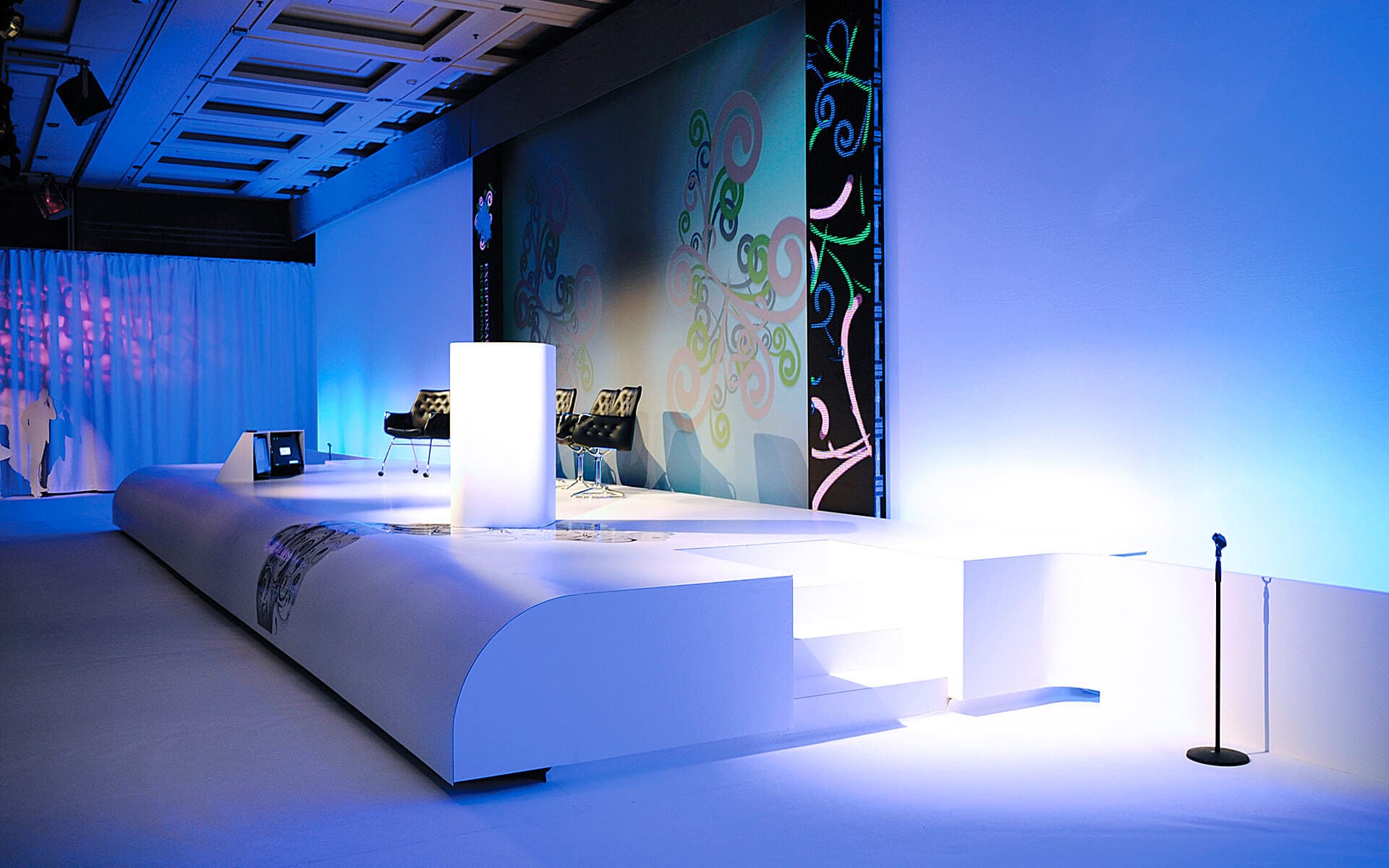 Side view of custom-built curved stage front, corporate event production Paris