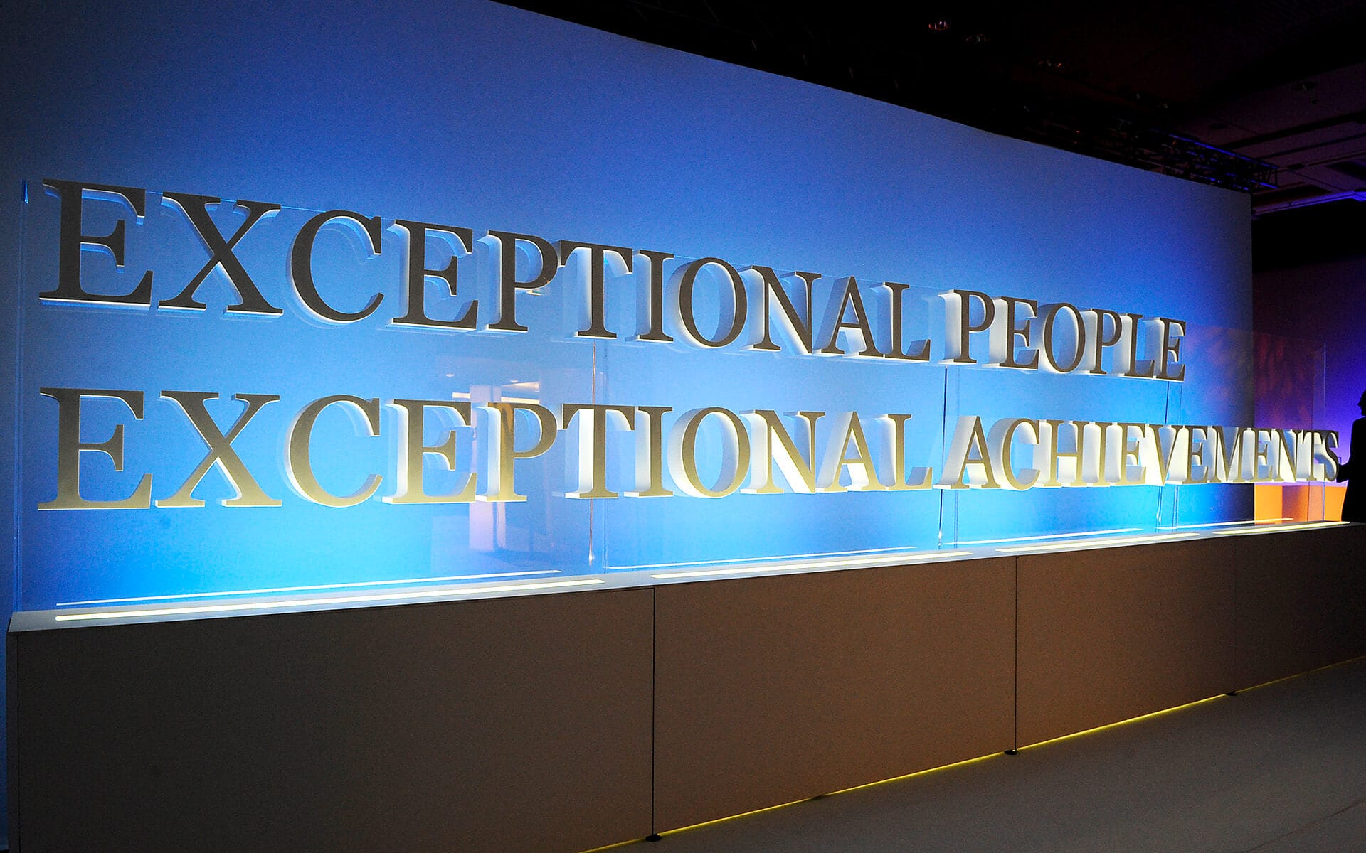 Illuminated welcome sign with cut-out foam board logo on acrylic light box, event Paris