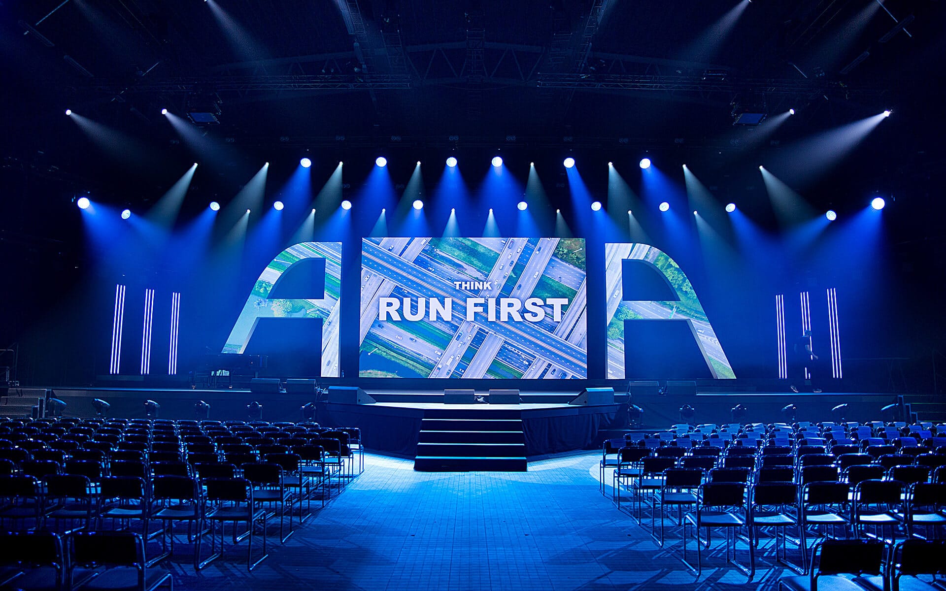 Lighting rig with 50 moving fixtures above event stage, Vinnarhallen Boson ATEA 2023