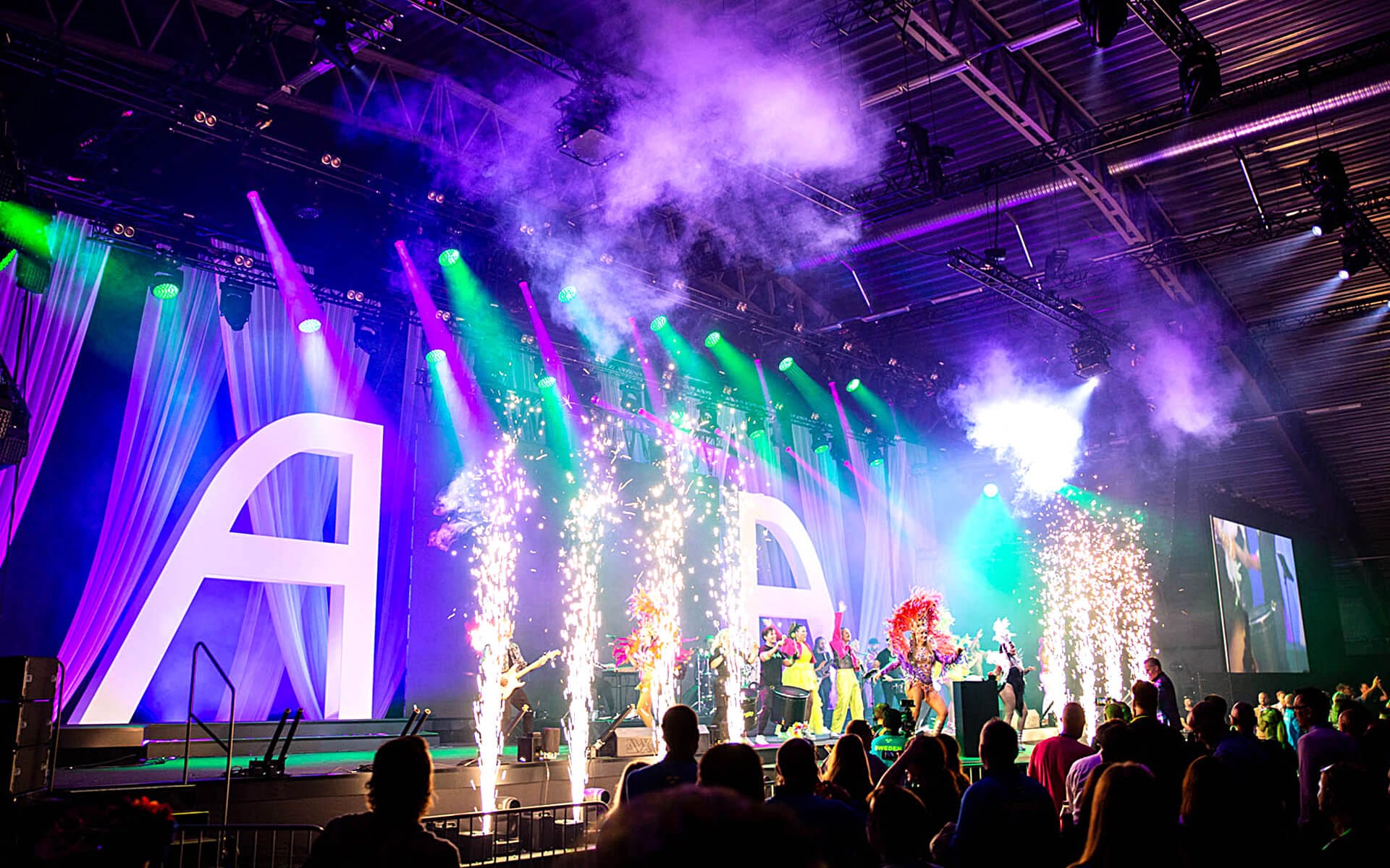 Carnival-themed stage with layered illuminated fabrics, ATEA National Team Camp 2023 Boson