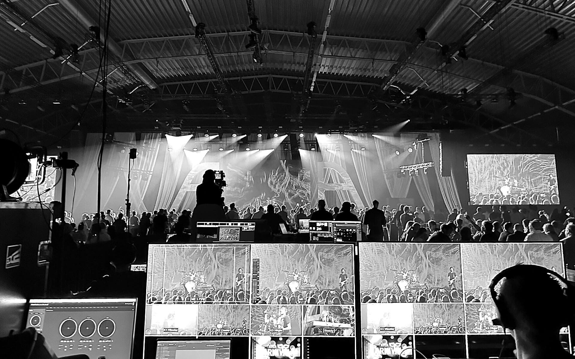 Video producer at FOH mixing station during live event, ATEA National Team Camp Vinnarhallen