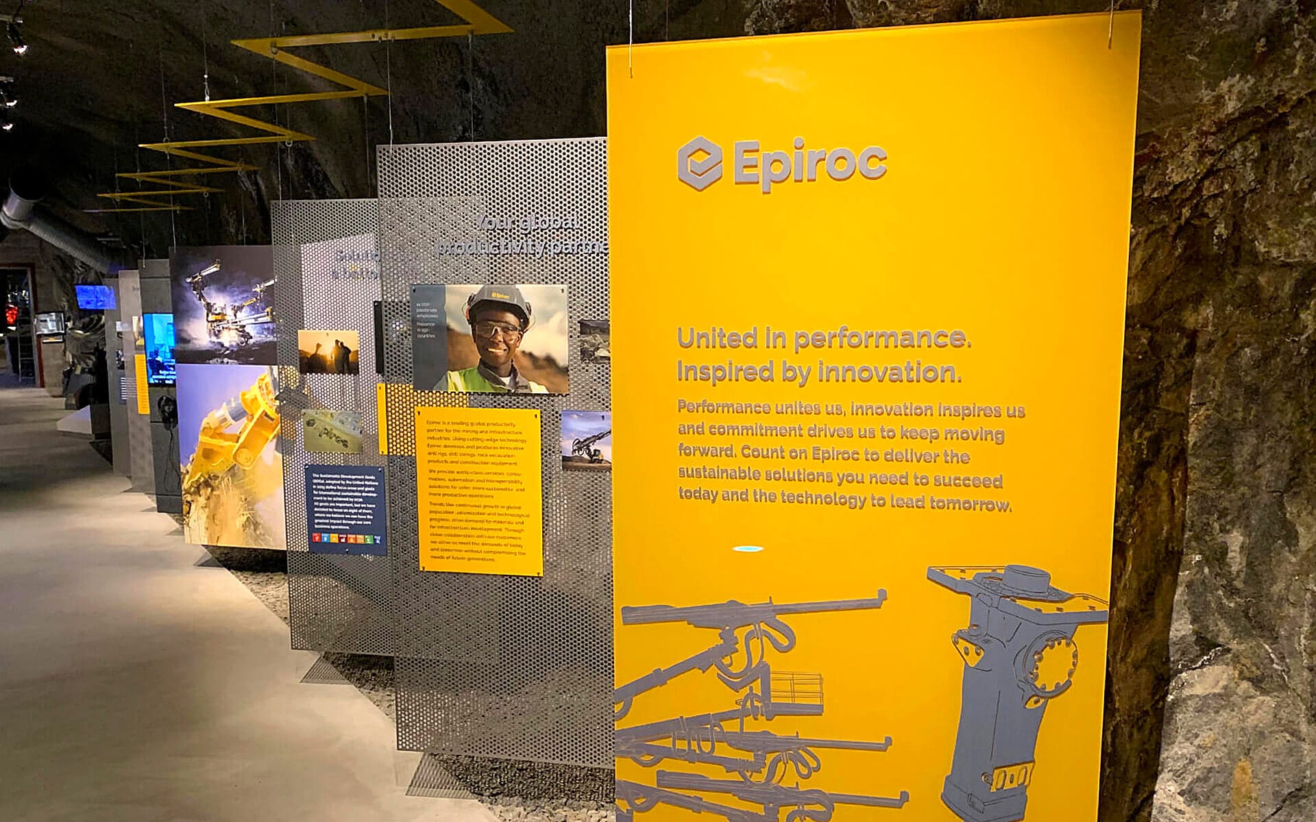 Right side of mine passage with freestanding metal signs and print, Atlas Copco Sickla