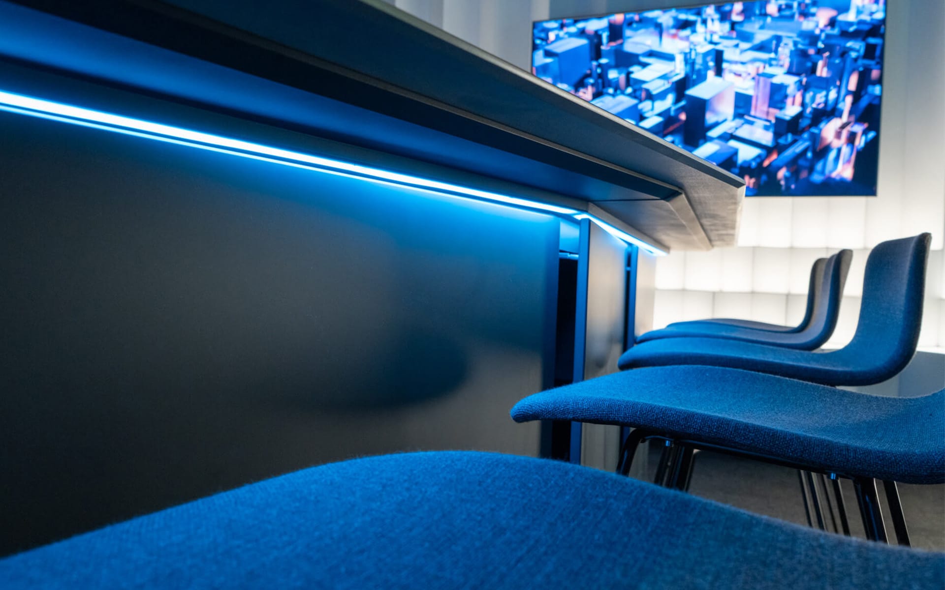 RGB LED strip recessed beneath conference table, Atlas Copco showroom Stockholm