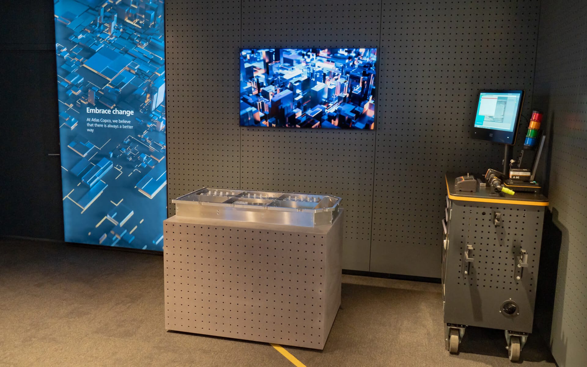 Close-up of product display unit with integrated lighting, Atlas Copco Experience Studio Stockholm