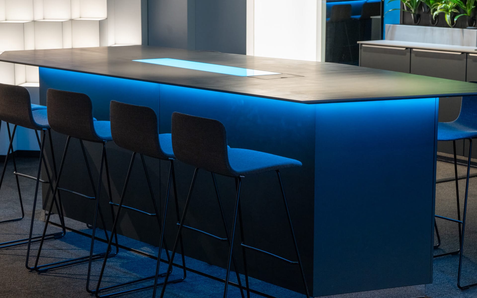 Conference table with 10 bar stools in Atlas Copco Experience Studio Sickla