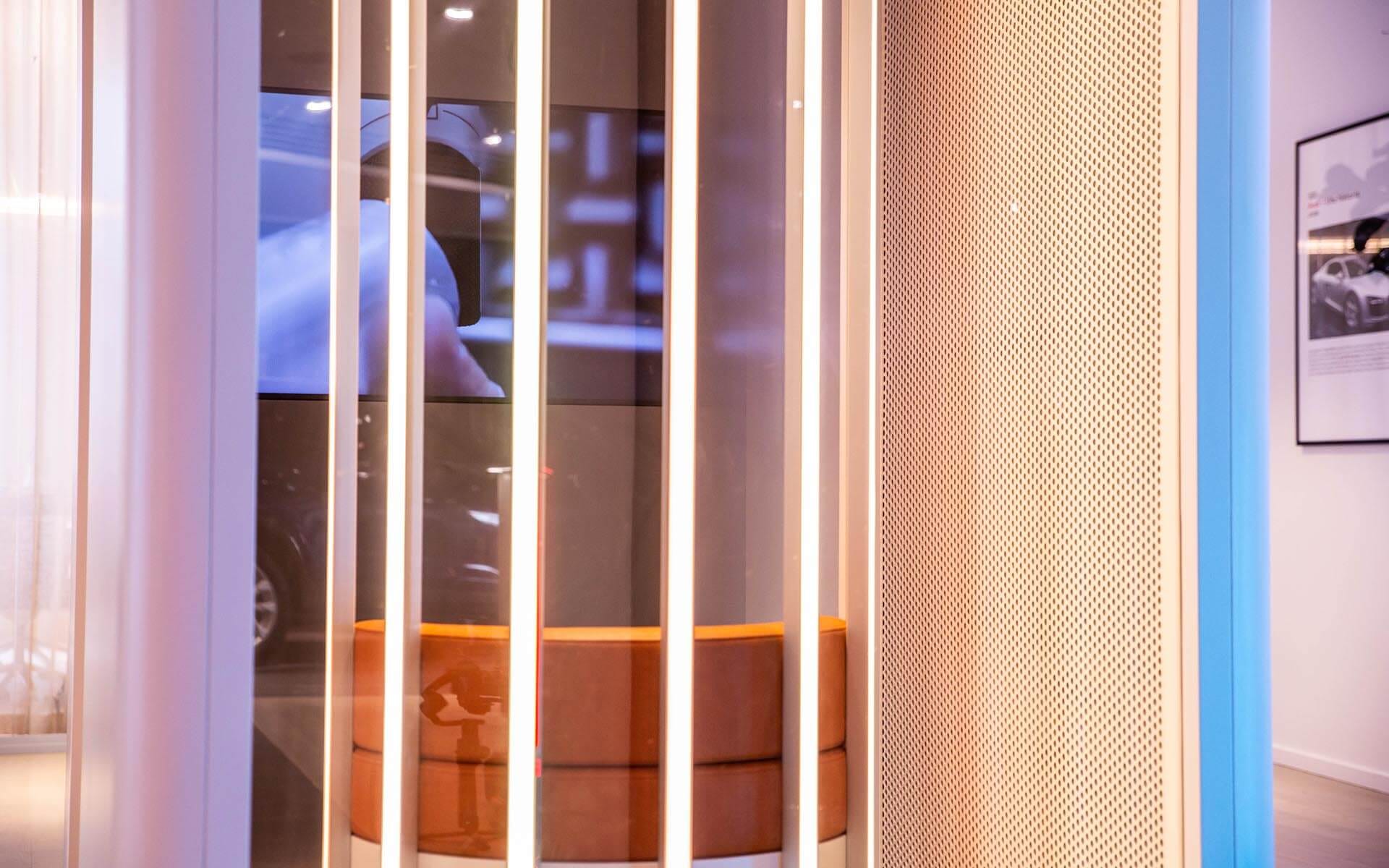 Close-up of moving light installation around leather chair, Audi E-tron GT experience hub Stockholm