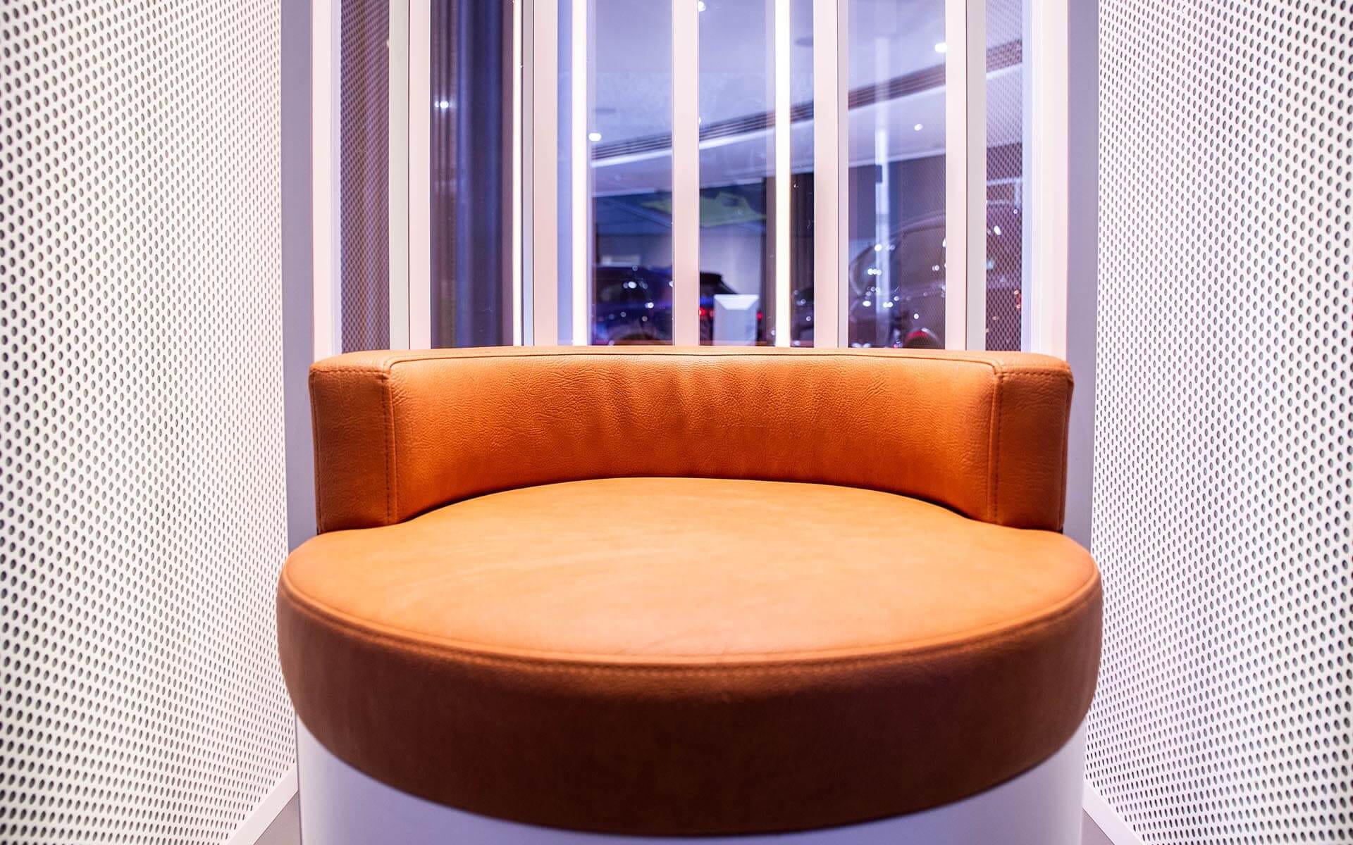 Custom-designed leather chair with built-in subwoofer, Audi E-tron GT experience hub