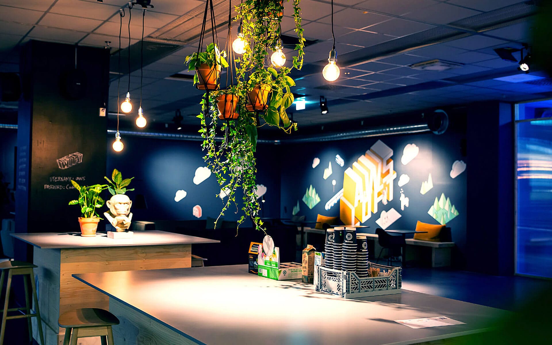 AWS Pop-up Loft – detail of the interior with custom seating and AWS-branded wall vinyl produced by EDGE's carpentry workshop and print department.