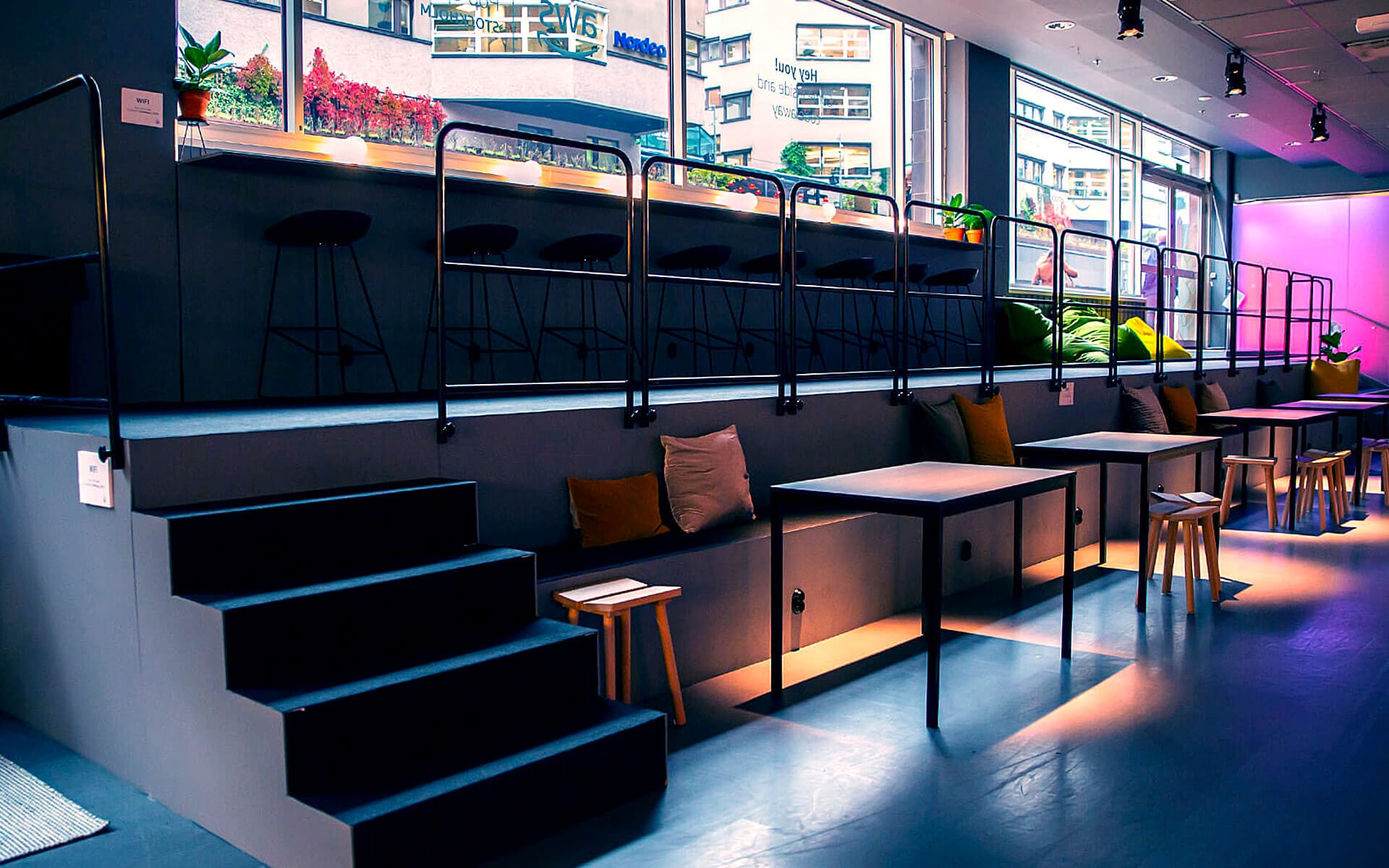 Custom-built tiered seating with integrated charging sockets, AWS Popup Loft Amazon Stockholm