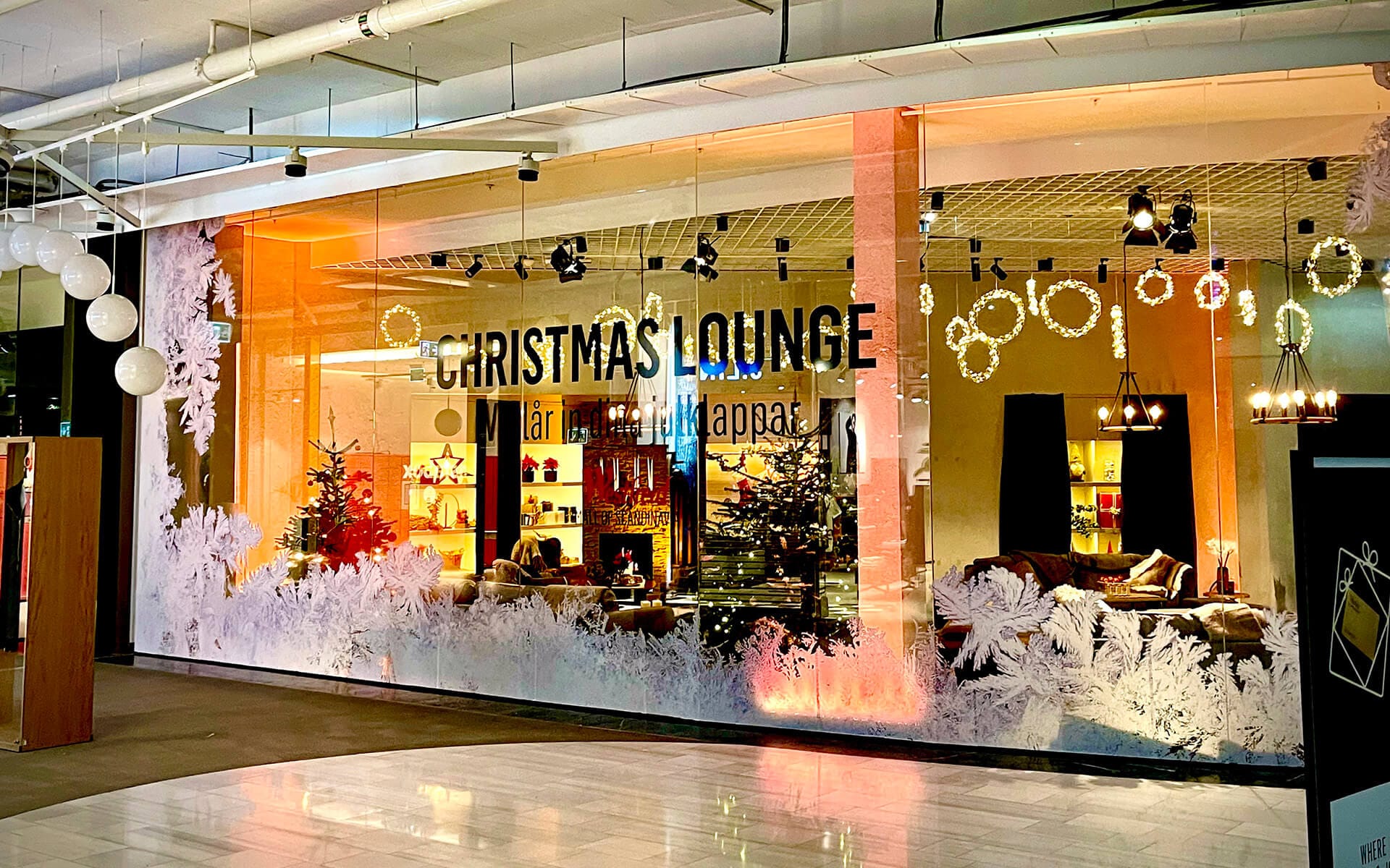 Christmas-branded vinyl wrap on shop window, Christmas Lounge Westfield Mall of Scandinavia