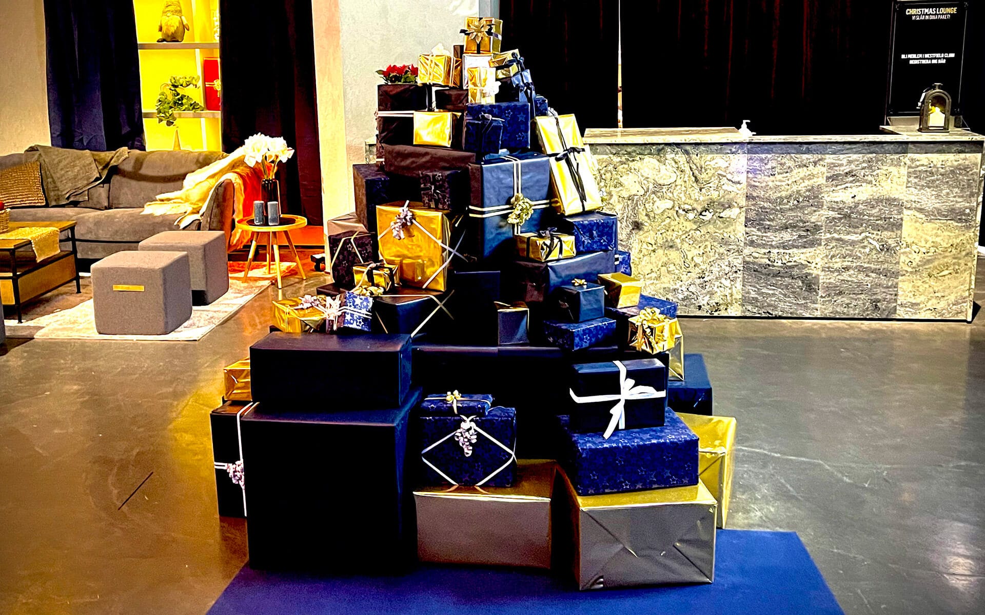 Stack of wrapped Christmas gifts as decorative element, Christmas Lounge Mall of Scandinavia