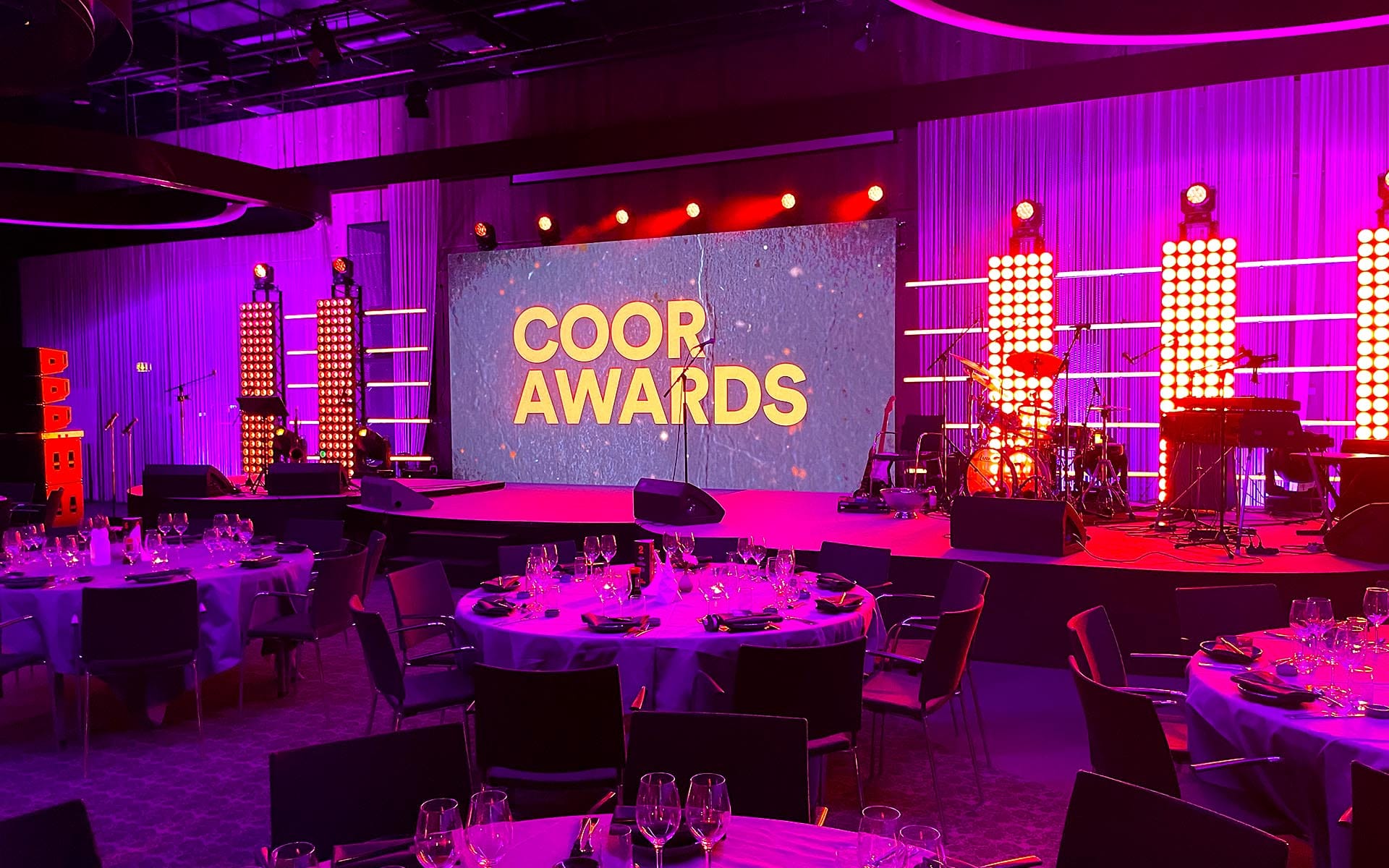 Lighting rig with Cameo matrix fixtures and Astera Titan Tubes flanking LED screen, Yasuragi