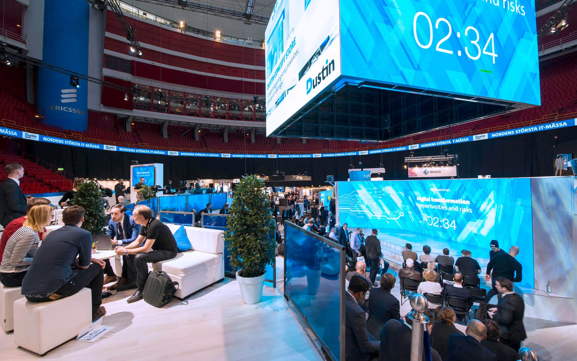 Dustin Expo 2017 – Dustin's exhibition stand with inspiration square, seating and stage under the Jumbotron. Stand and set design produced by EDGE.