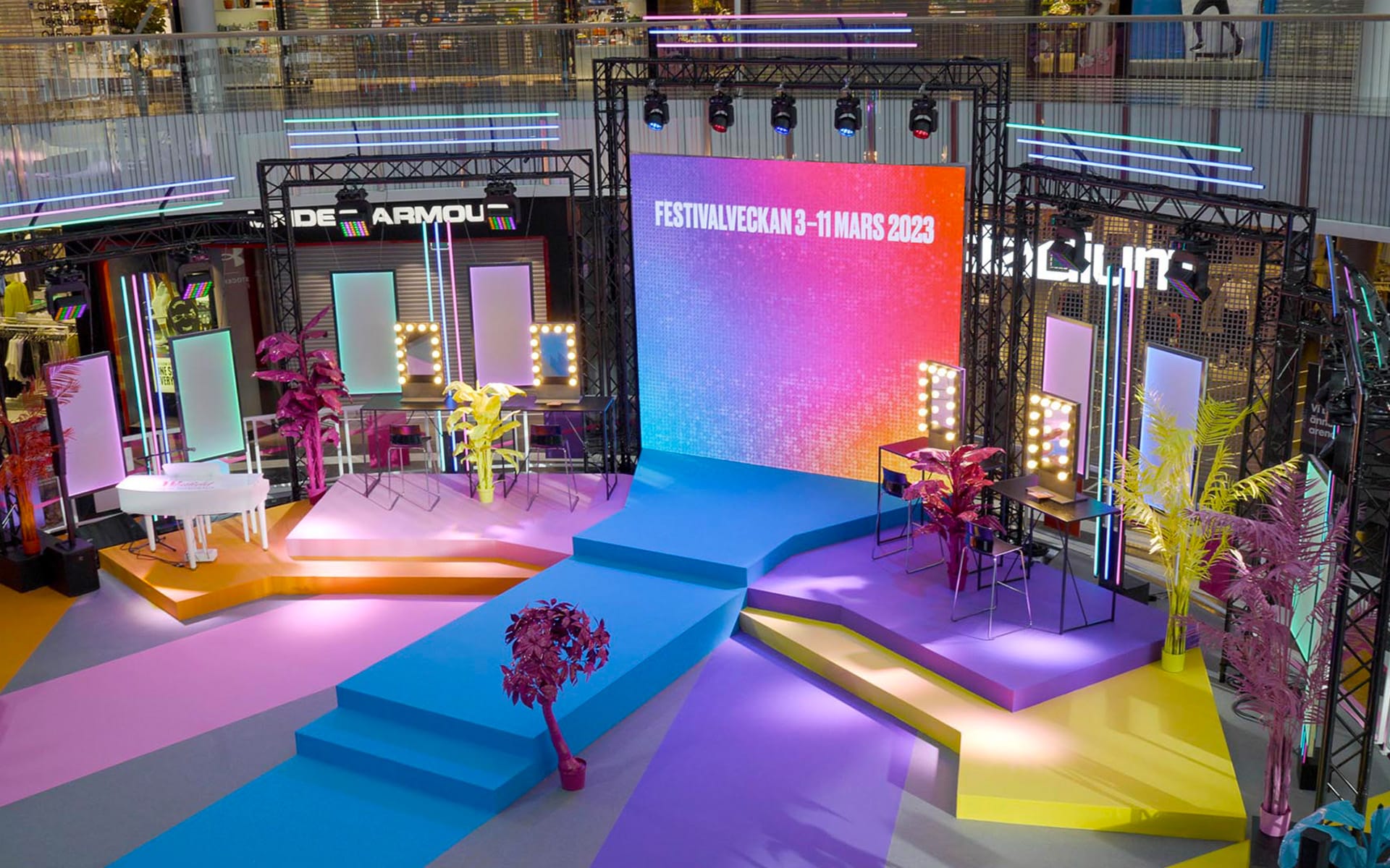 Makeup stations flanking LED screen, Festival Week Melodifestivalen Mall of Scandinavia