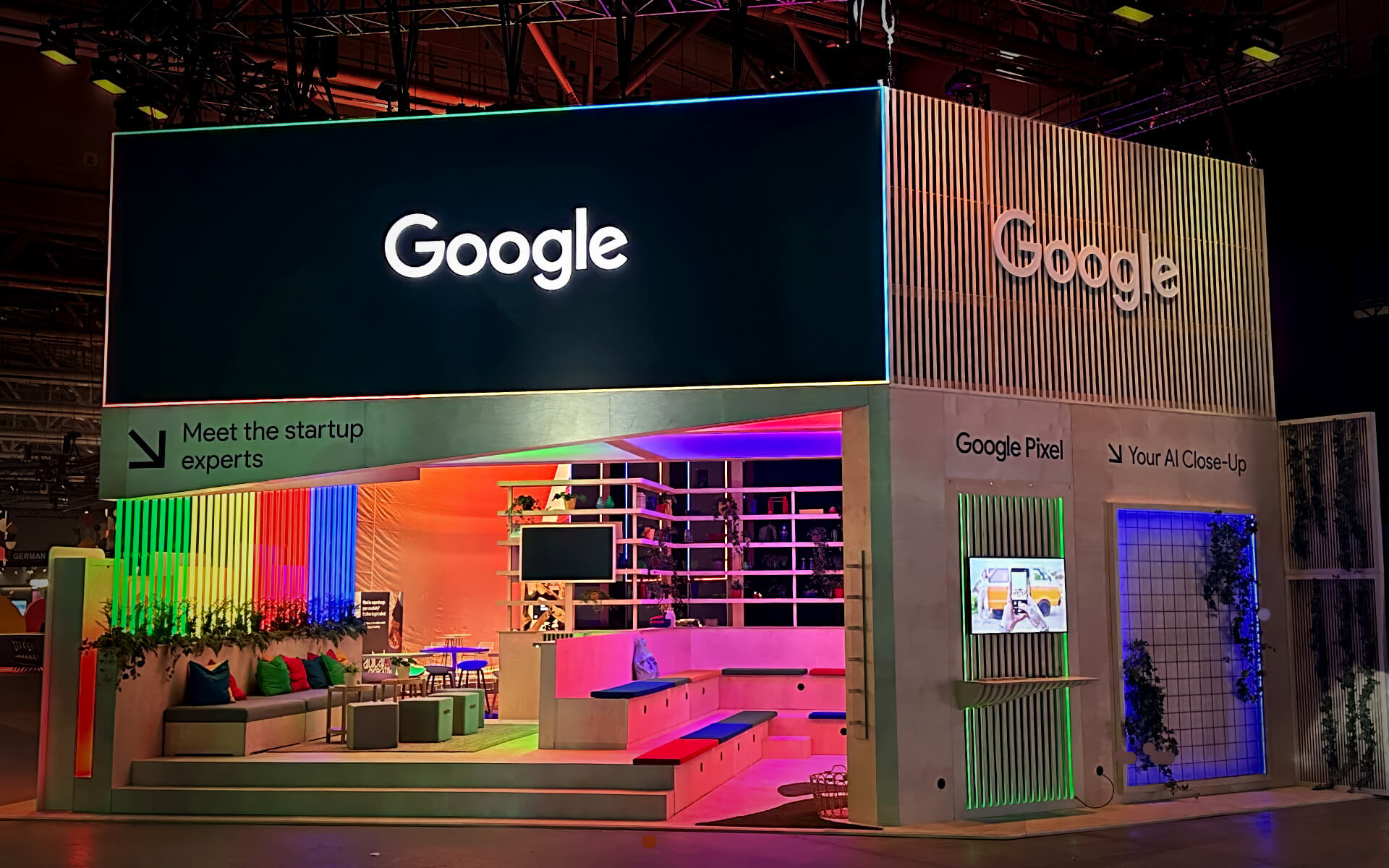 Trellis walls with Google's cut-out logo framing the booth