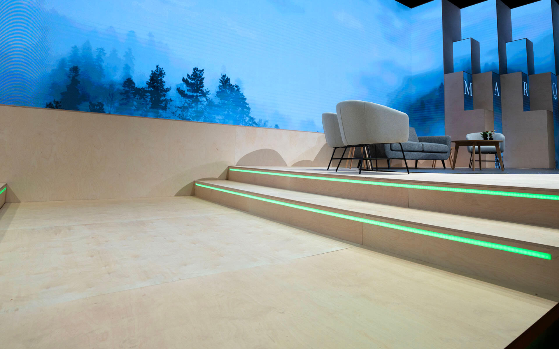Detail view of the stage with plywood structures and LED