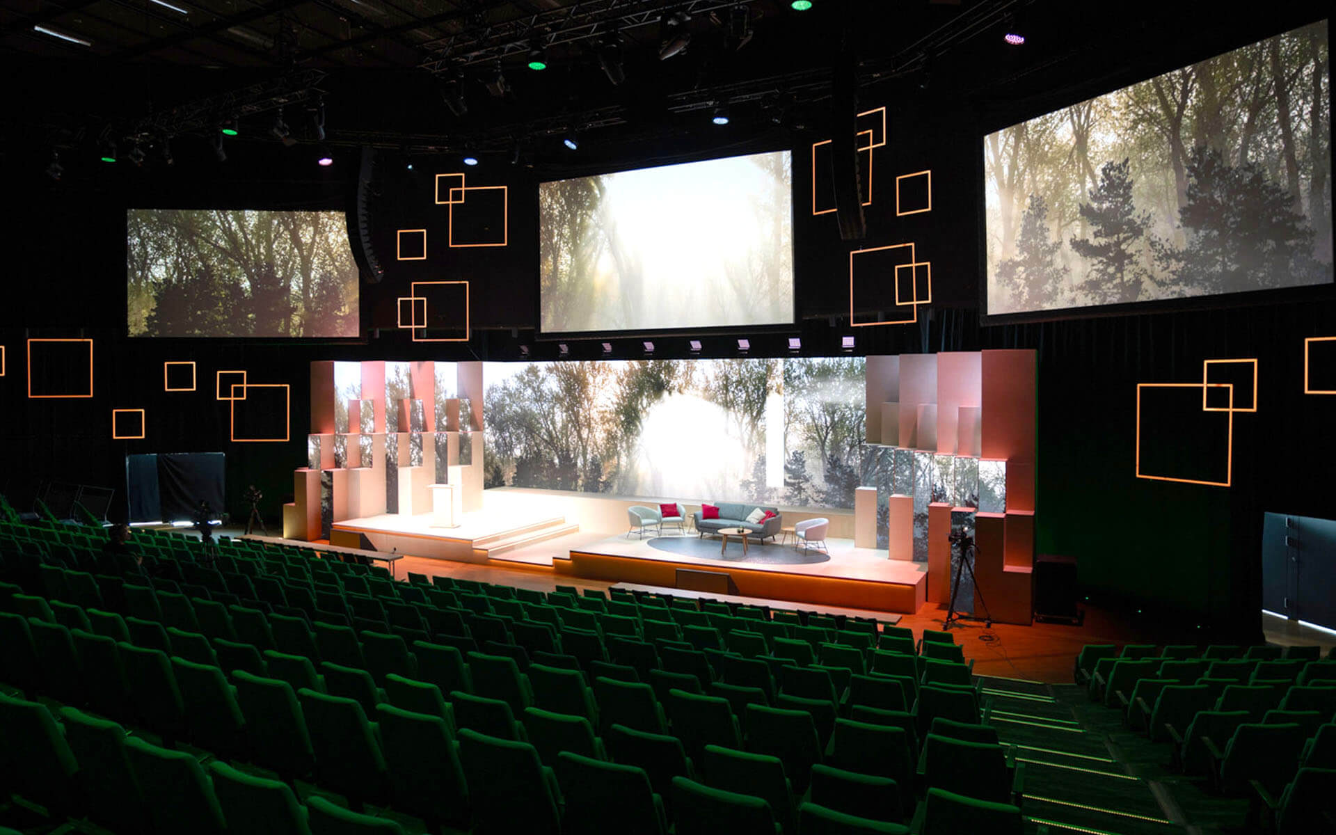 Lighting design around the stage with floor-rigged light squares