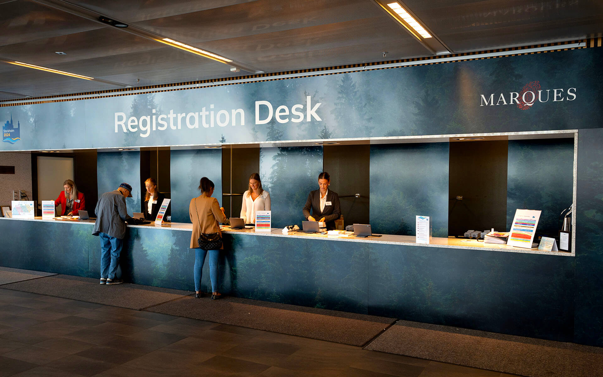 Vinyl-wrapped registration desk at the entrance