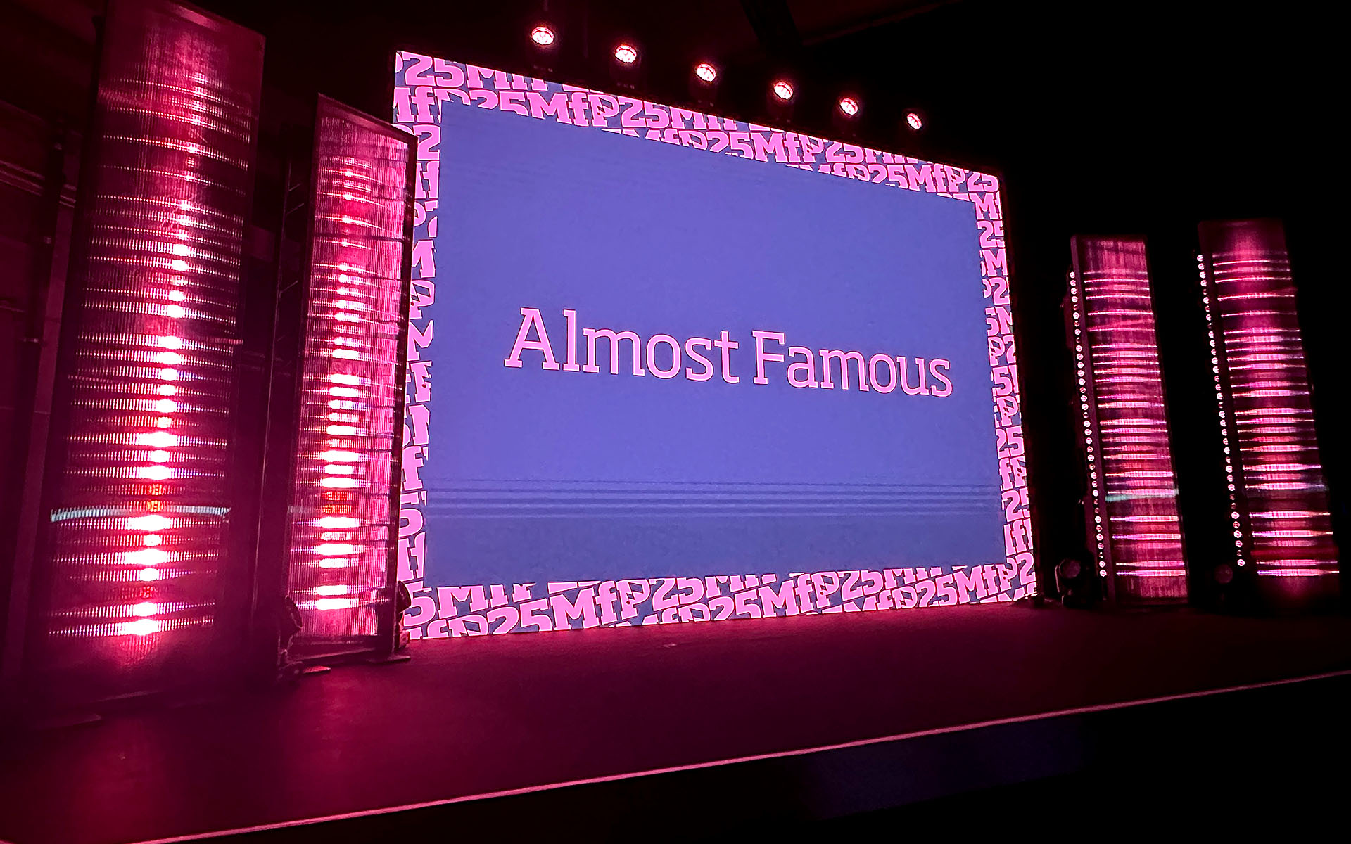 Set design with black trellis walls on stage edges