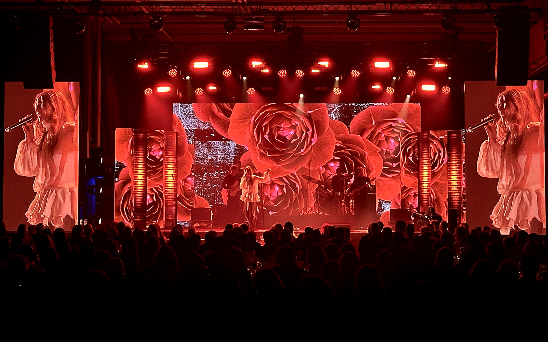 Artist on stage in full stage lighting