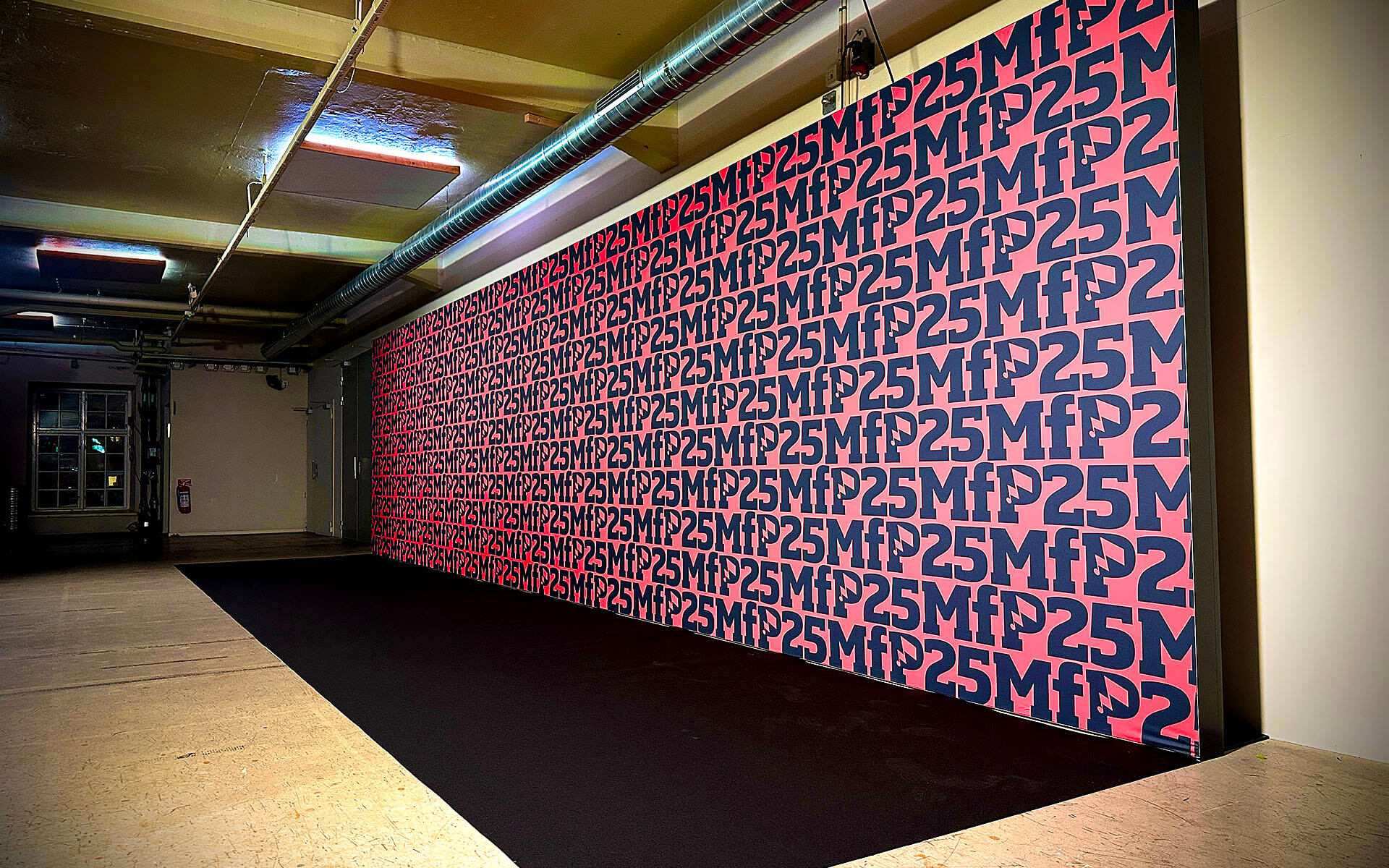 Photo wall in the Foyer with printed banner