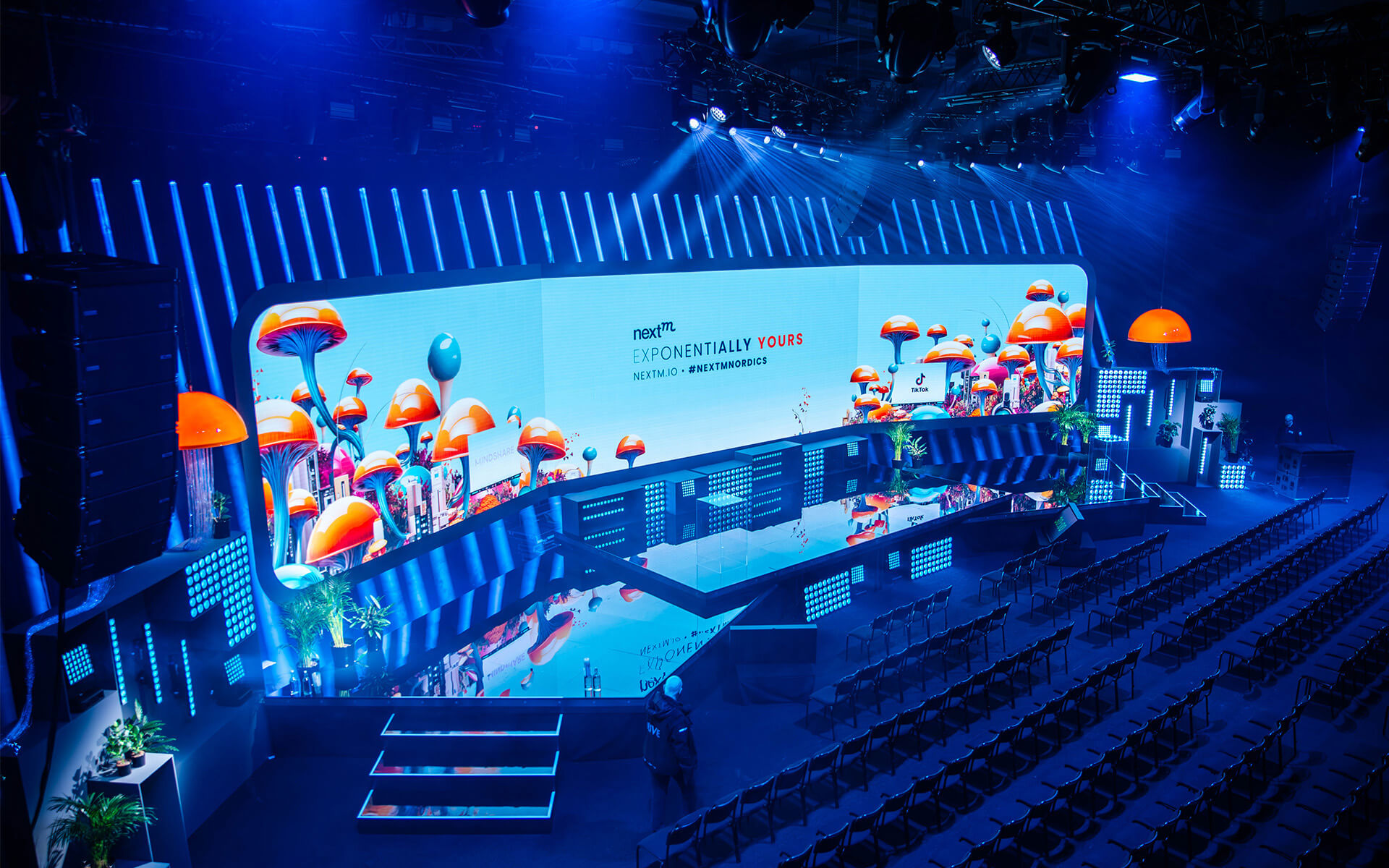 Main stage at NextM 2024 with 70 m² LED wall and mushroom installations