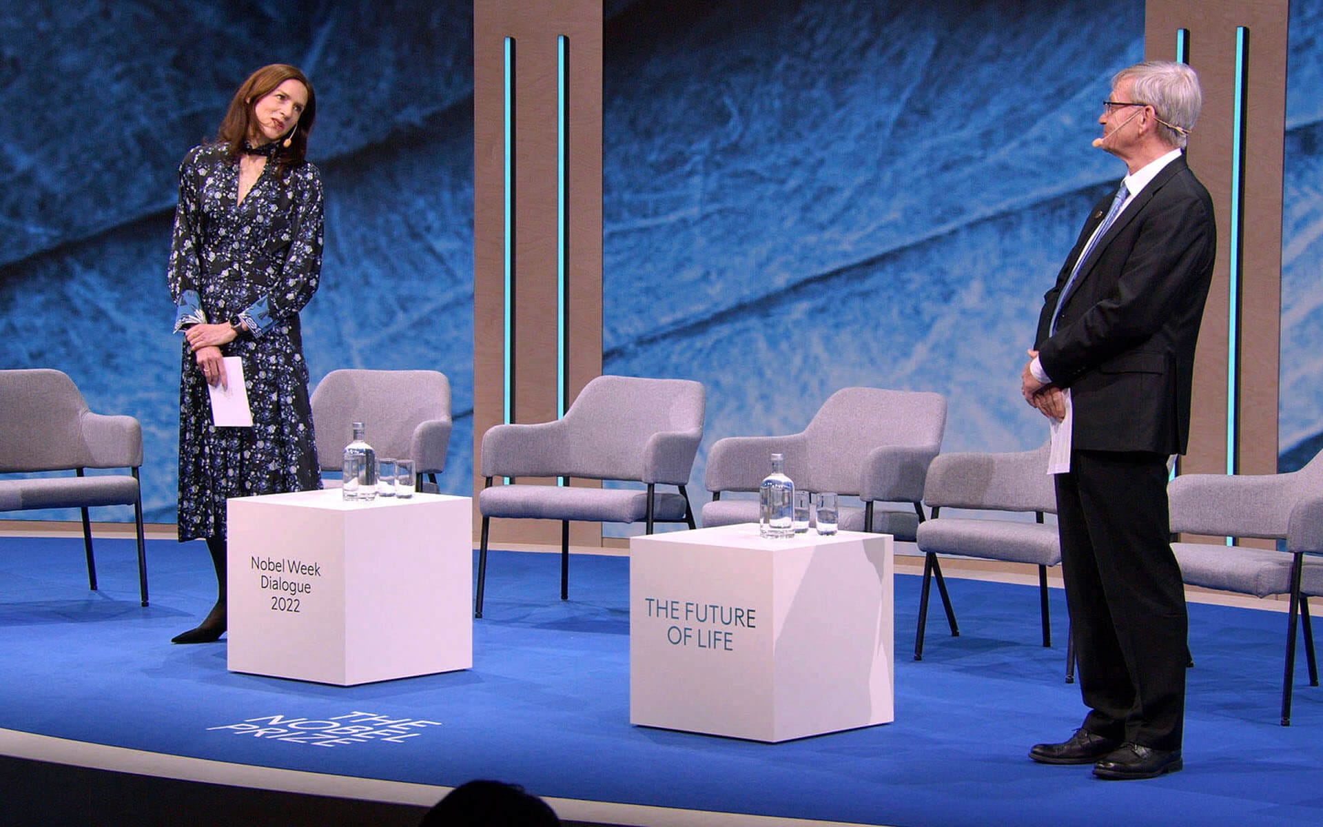 Laura Sprechimann and Carl-Henrik Heldin on stage, Nobel Week Dialogue 2022 Stockholm Waterfront