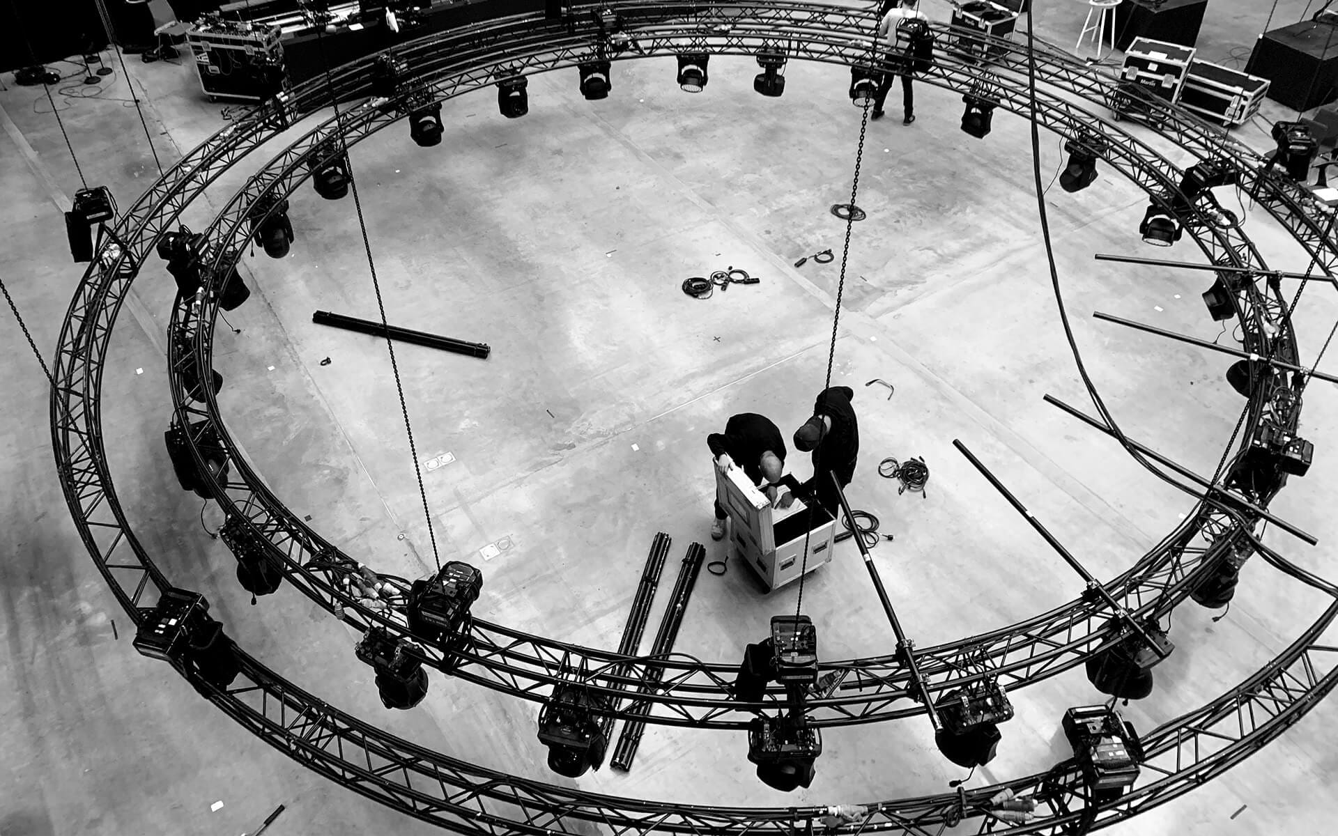 Black circular truss with Clay Paky Mythos 2, Martin Quantum Wash and GLP X4 bars, Oriflame studio