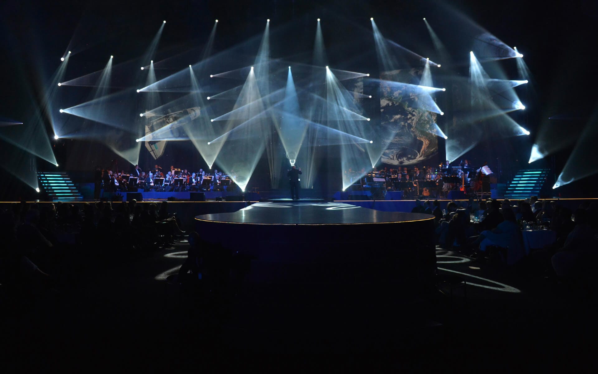 Anders Berglund and symphony orchestra on stage, Sandvik 150th anniversary Göransson Arena