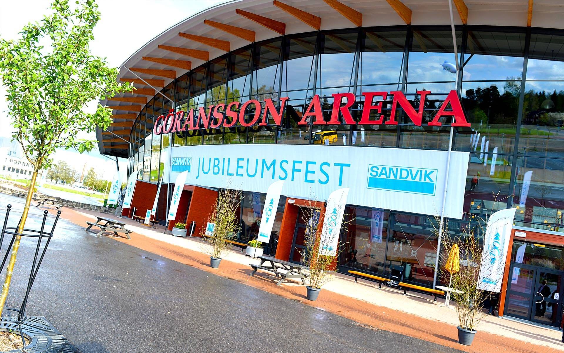 Entrance to Göransson Arena branded with printed banners in Sandvik style