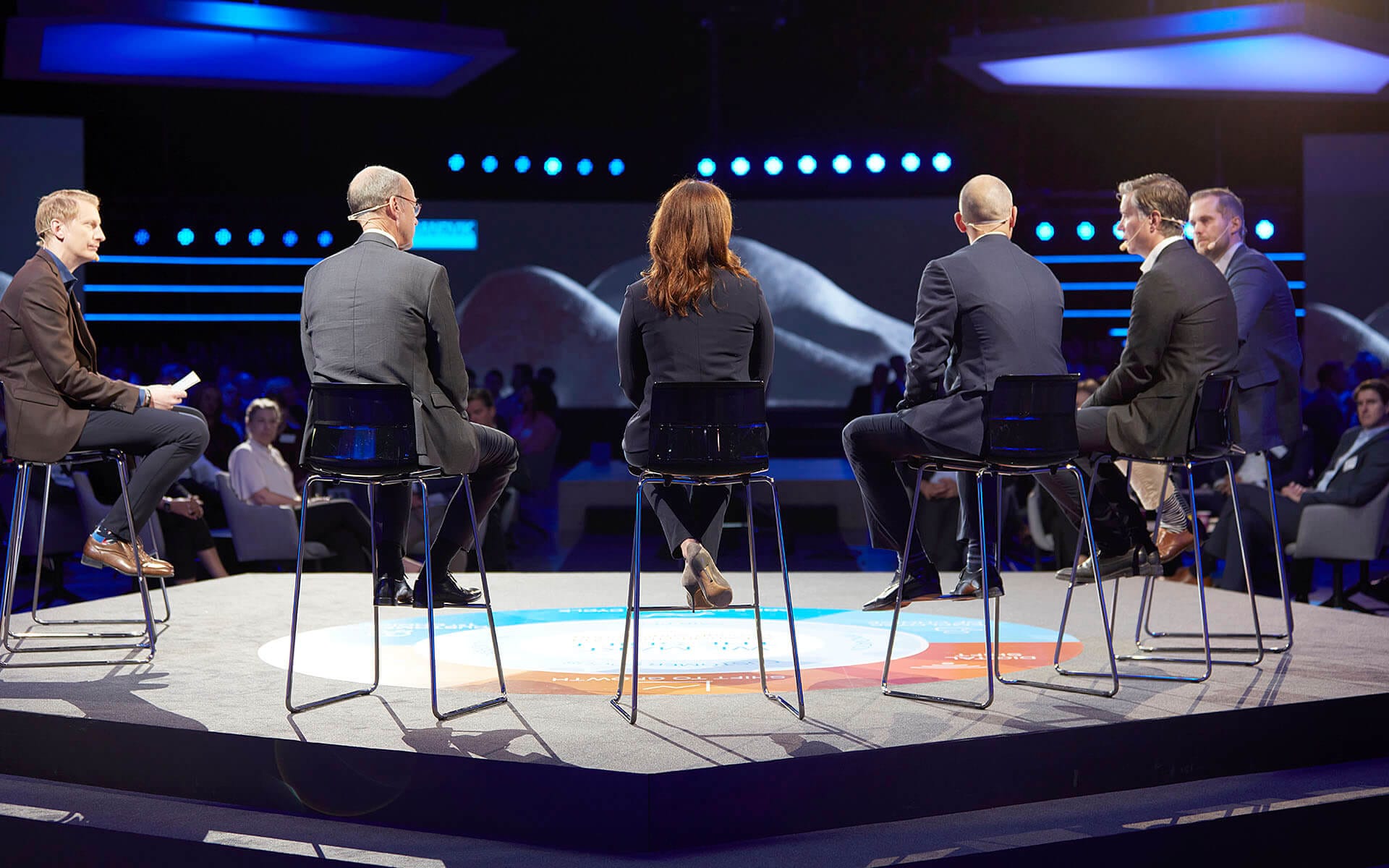 Panel discussion on satellite stage at Sandvik TMM – a separate furnished breakout stage integrated into the overall video system.