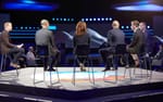 Paneldialog på satellitscen med konferensscenen i bakgrunden, Sandvik TMM 2022 Strawberry Fields