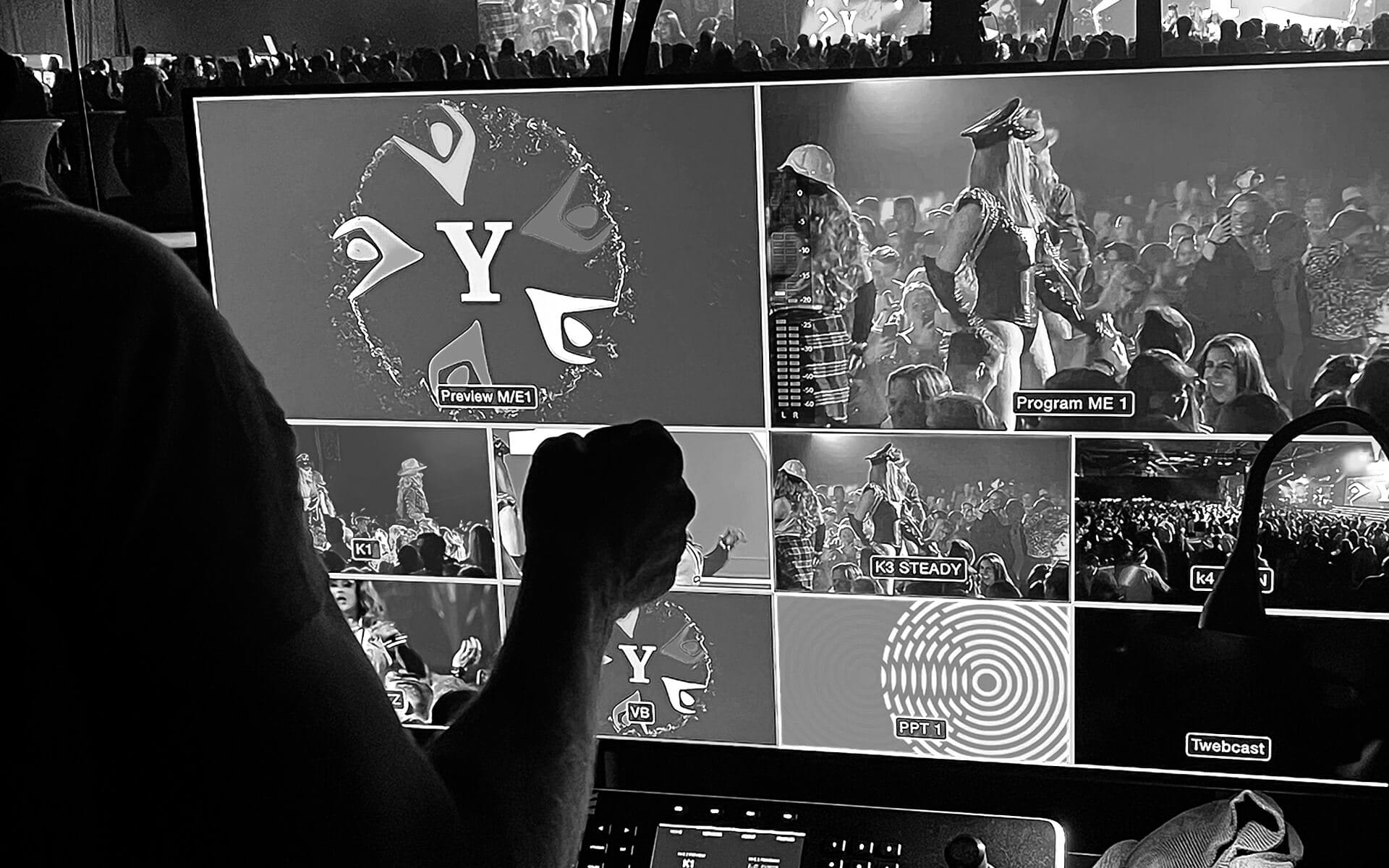The video director steers the camera production and selects which camera is shown to the audience.