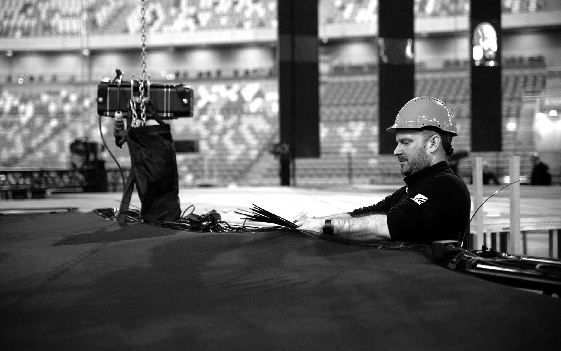 Henrik Hansson rigging stage at 3Arena – arena-scale stage installation demands experience and precision.